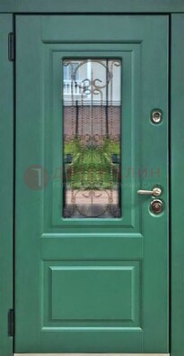 Зеленая металлическая дверь со стеклом и ковкой ДСК-113 в Климовске