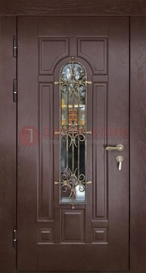 Темная железная дверь со стеклом и ковкой для частного дома ДСК-156 в Климовске